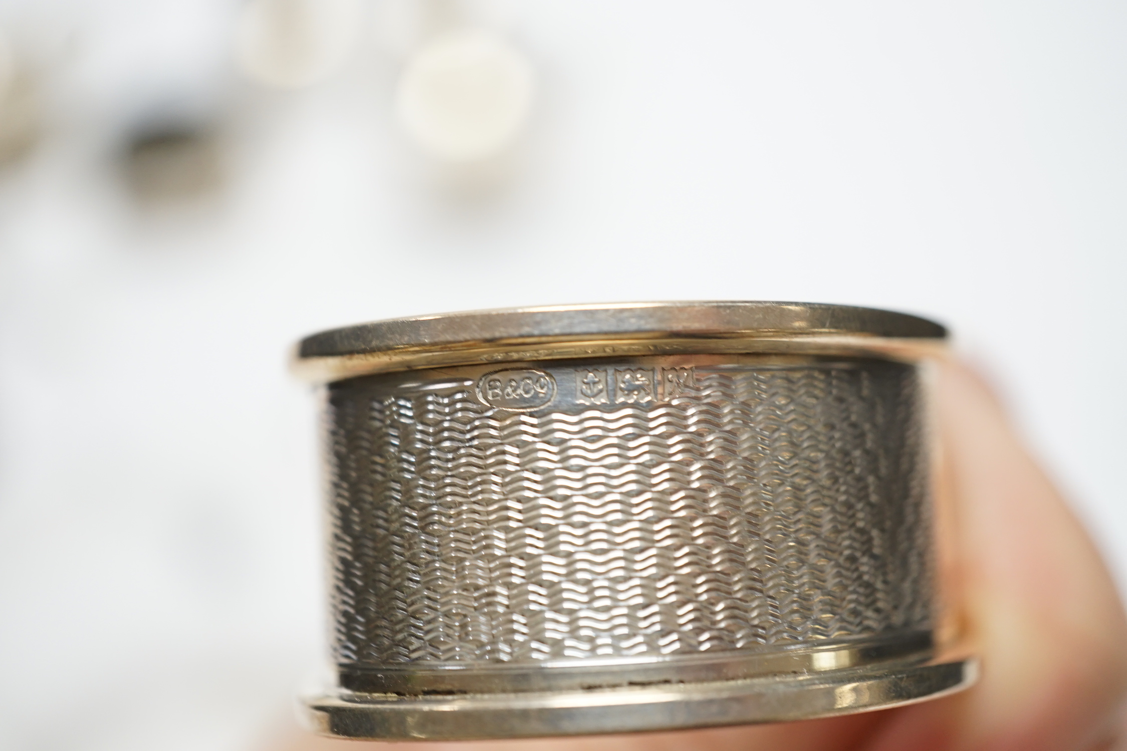 Six assorted silver cruets and three silver napkin rings.